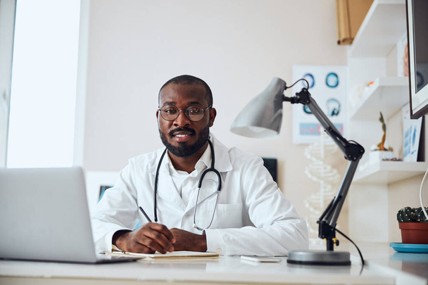 Physician with a stethoscope at his workplace - Photo, Image