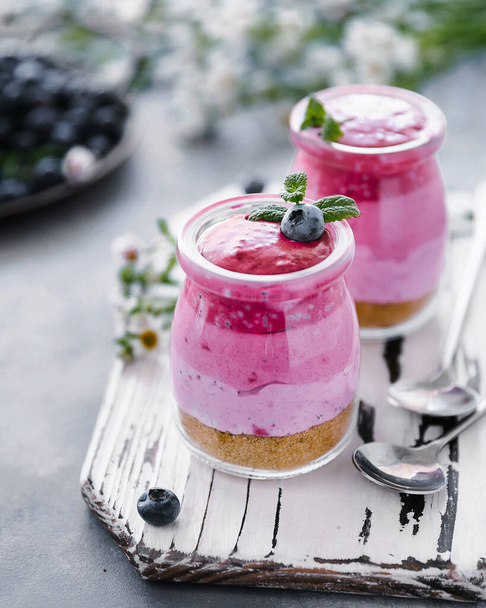 layered mousse dessert with flowers and berries berry - 写真・画像