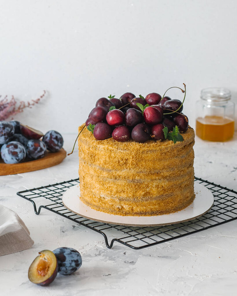 home made honey cake with berries  - 写真・画像