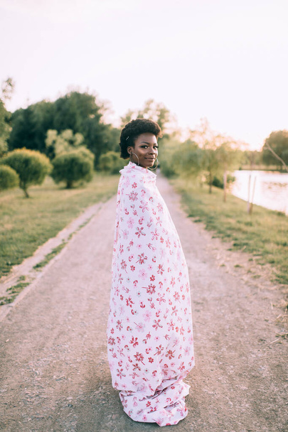 African american model posing in funny dress at sunset outdoor - Fotó, kép
