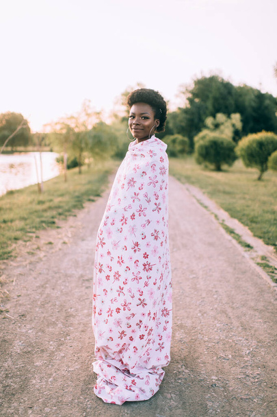African american model posing in funny dress at sunset outdoor - Valokuva, kuva