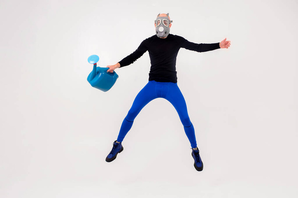 Funny strange man in respirator jumping over white background - Photo, image