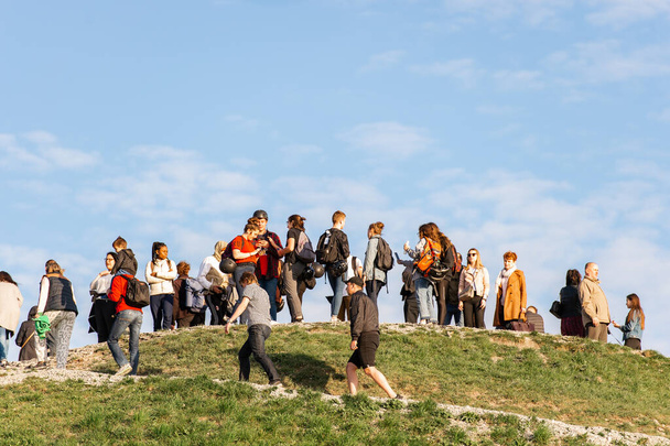Krakow, Poland - April 26, 2019: View at Krakus mound (Kopiec Kraka) with people on it. - Photo, Image