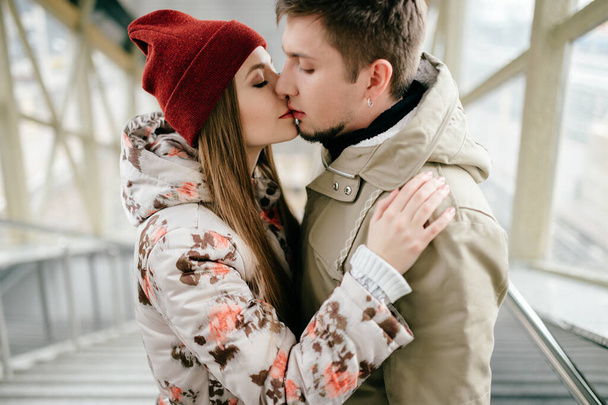 Lifestyle people. Young happy lovers embracing on meeting. Romantic pair of stylish cheerful hipsters hug. Girl in love. Happiness of loving youth couple. Emotional portrait of beautiful woman face  - Photo, image