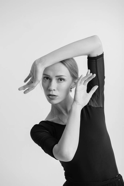 Portrait of flexible girl gymnast do stretch on white background - Zdjęcie, obraz