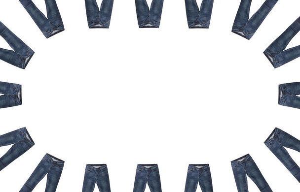 Front pockets, waist, leg areas, zippers, and buttons of 16 pairs of dark blue jeans isolated, white background. Close up shot. Jeans encircle copy space in the middle. Clothing, jeans store concept. - 写真・画像