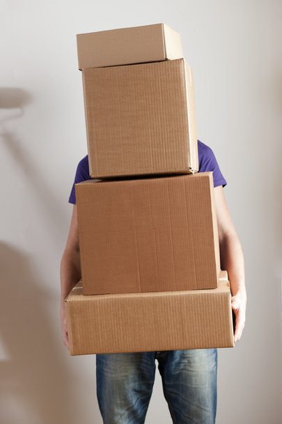 Man Carrying Stacked Boxes - Valokuva, kuva