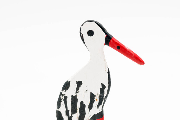 A profile shot of a stork garden figure isolated in the white background - Photo, image