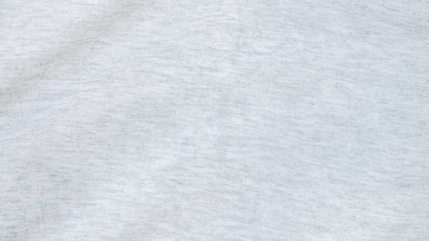 Haute résolution, prise de vue détaillée de fond en tissu jersey gris blanc doux. Papier peint de vêtements polyester et coton avec espace de copie pour le texte. - Photo, image