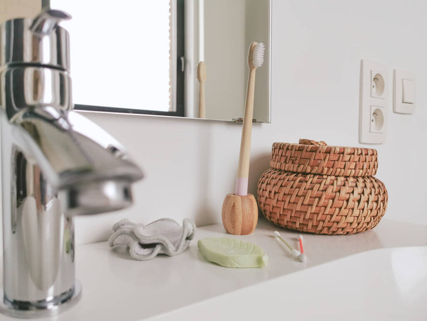 Zero waste bathroom concept with plastic free and reusable products such as silicone cotton swabs and bamboo toothbrush. Sustainable lifestyle. - Zdjęcie, obraz