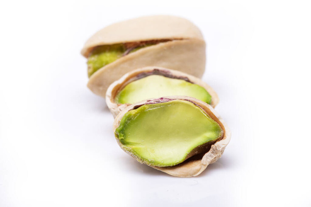 Pistachios isolated on a white background - Foto, imagen