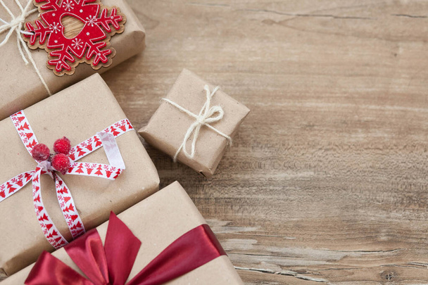 Christmas gift boxes on wooden background. New Year presents. - Foto, Imagem