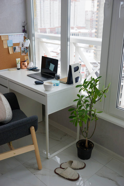 Office desk with laptop and coffee cup at home - Photo, Image