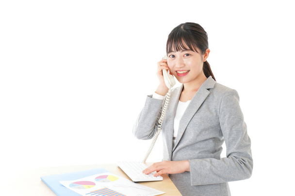 Young businesswoman using telephone - Φωτογραφία, εικόνα