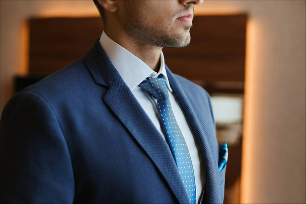 Unrecognizable handsome man in a blue tie and formal blue suit - Fotoğraf, Görsel