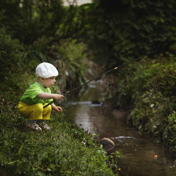 photo of little boy fishing - Foto, Imagen