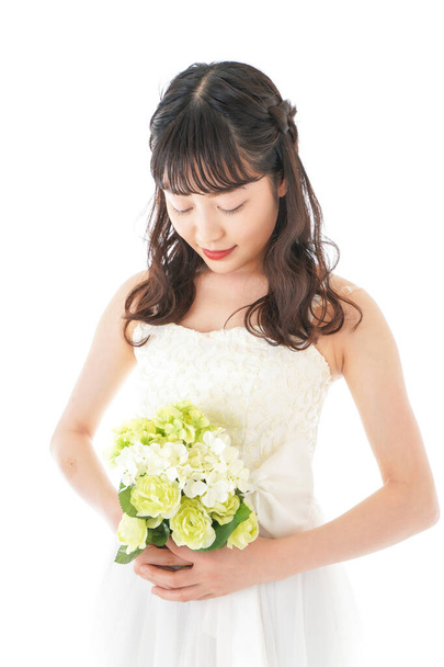 Young woman in dress having a bouquet - Φωτογραφία, εικόνα