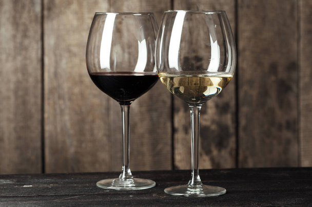 Glass of Wine on The Wooden Table - Valokuva, kuva