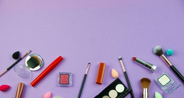 lots of makeup on a purple background - Foto, immagini