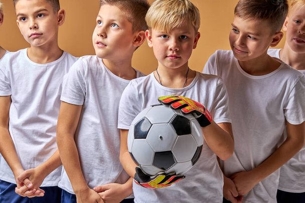 portrait of boy goalkeeper and his friends near him - Zdjęcie, obraz