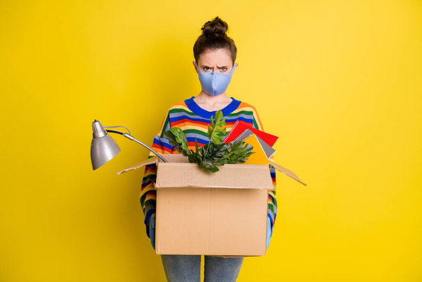 Photo of girl hold box got fired wear blue mask gloves from corona rainbow sweater pants isolated on bright yellow color background - Fotografie, Obrázek