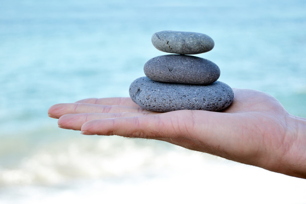 Zen stenen in de hand - Foto, afbeelding