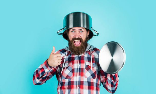 male hipster with fashionable groomed hair and beard cooking with pan, chef - Fotoğraf, Görsel