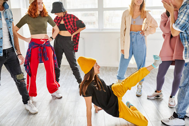 female dance teacher recording a new dance video in studio with pupils - Fotoğraf, Görsel
