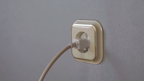 Electricity consumption - plugging power plugs into wall outlet. Time lapse. The concept of energy savings - Footage, Video