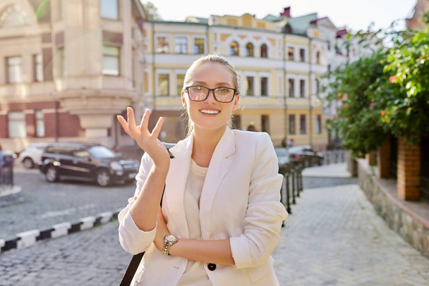Outdoor portrait of young business positive woman in the city - Fotografie, Obrázek