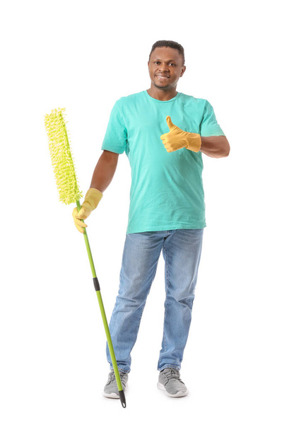 African-American man with mop showing thumb-up on white background - Foto, immagini