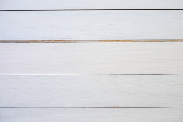 古い白い木の床は、あなたのデザインをコピースペースで背景のために使用したり、仕事が良く見えるようにテキストを追加することができます。ウェブサイトや壁紙のための高解像度木製の背景。表面という概念は - 写真・画像