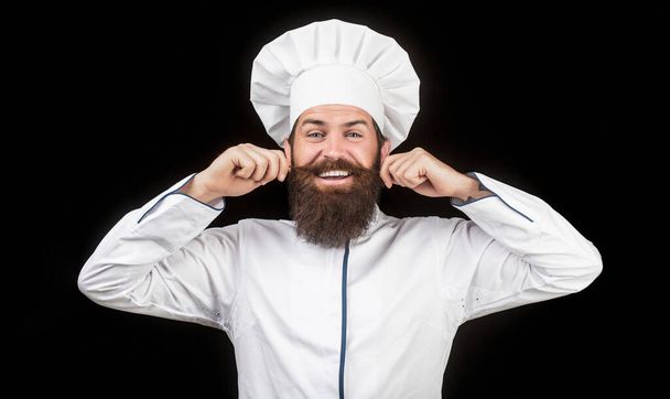 Cook hat. Bearded chef, cooks or baker. Bearded male chefs isolated on black. Funny chef with beard cook. Beard man and moustache wearing bib apron. Nappy man. Portrait of a happy chef cook - Photo, Image
