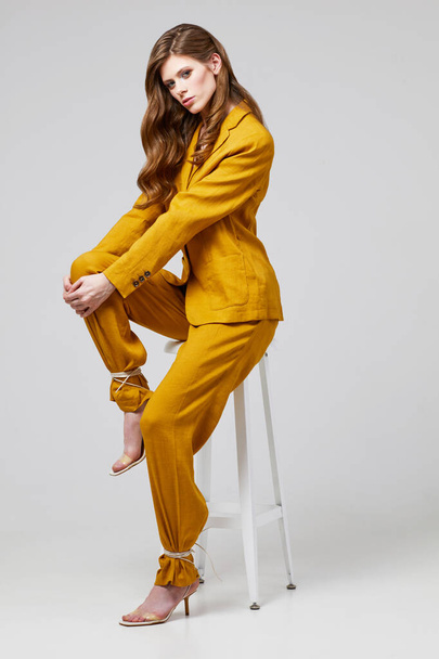 Fashion portrait of young elegant woman in trendy linen suit. Studio shot. - Fotoğraf, Görsel
