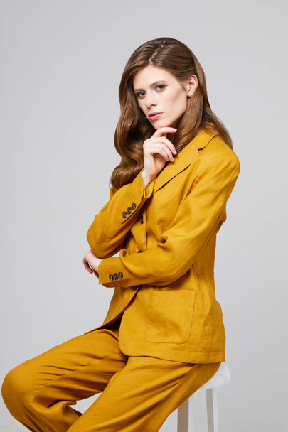 Fashion portrait of young elegant woman in trendy linen suit. Studio shot. - Φωτογραφία, εικόνα