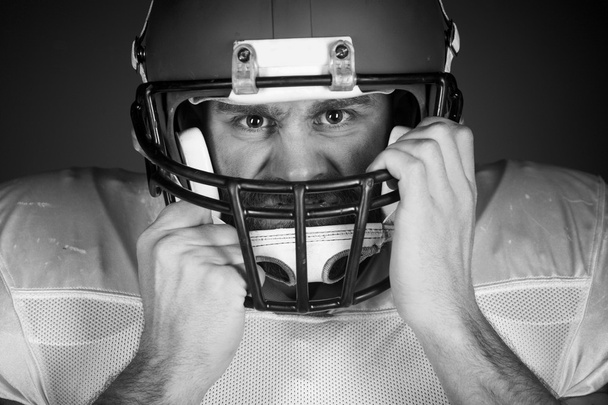 American football player  on the uniform, studio shoot - Zdjęcie, obraz