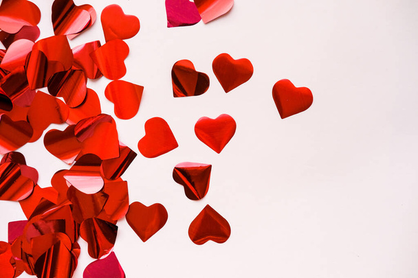 Red heart confetti on February 14 for Valentine's Day. - Photo, Image
