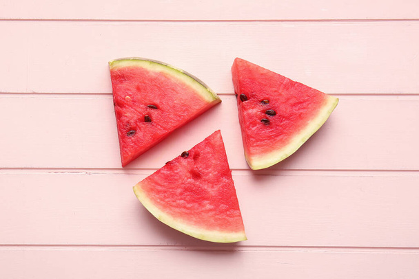 Slices of ripe watermelon on wooden background - Photo, Image