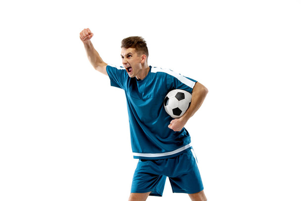 Funny emotions of professional soccer player isolated on white studio background, excitement in game - Valokuva, kuva