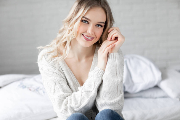 Portrait of a happy young woman at home - Fotografie, Obrázek