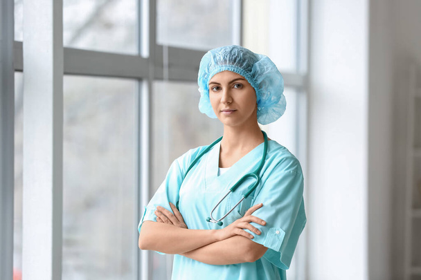 Portrait of female doctor in clinic - Foto, afbeelding