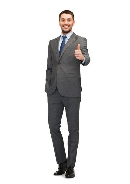 Handsome buisnessman showing thumbs up - Photo, image