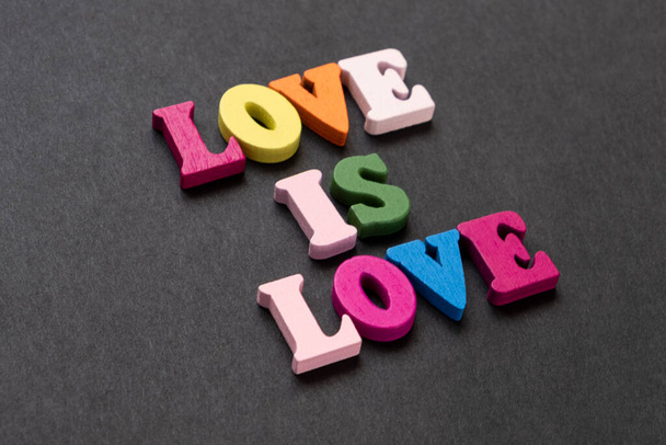 words love is love, notepad with chalk drawn heart. Valentine's day concept. - Zdjęcie, obraz