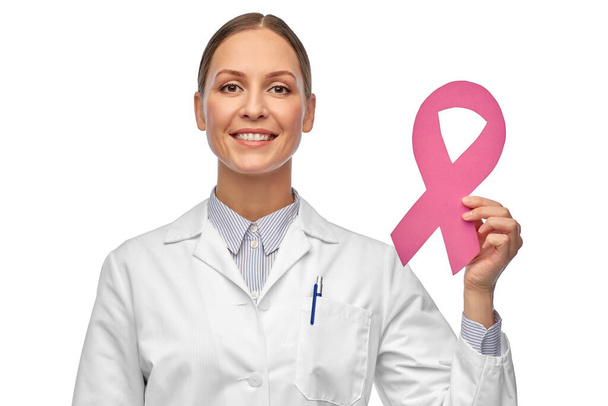female doctor with breast cancer awareness ribbon - Φωτογραφία, εικόνα