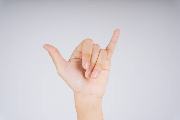 Y in hand sign language. Six in Chinese language. Carabao hand gesture isolate over white background. - Zdjęcie, obraz
