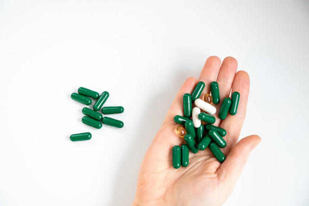 hand holding piils, capsules - Foto, Imagen