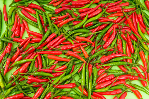 Background made of green and red peppers - Photo, Image