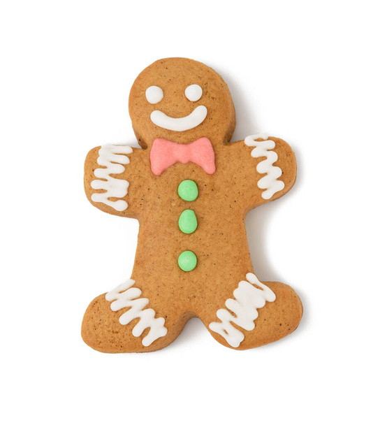 baked gingerbread man shaped with smile isolated on white background, top view - Photo, Image