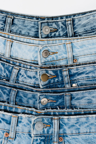 closed up view of various blue jeans isolated on white - Photo, Image