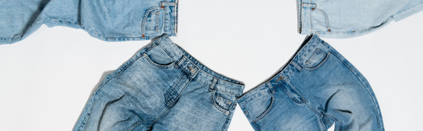 top view of different blue jeans on white background, banner - Valokuva, kuva